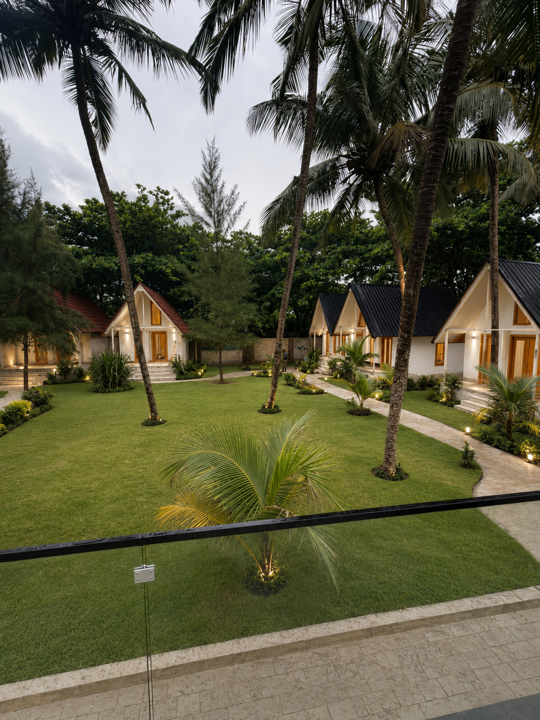 The A-frame village of Irele Beach Resort among the palms